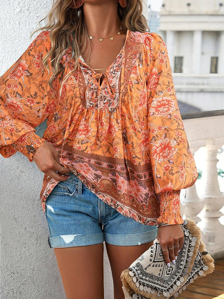 Damenbluse mit Blumenmuster und langen Puffärmeln