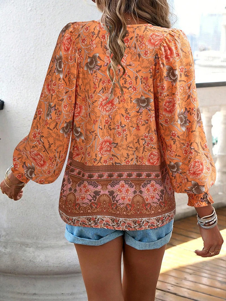 Damenbluse mit Blumenmuster und langen Puffärmeln